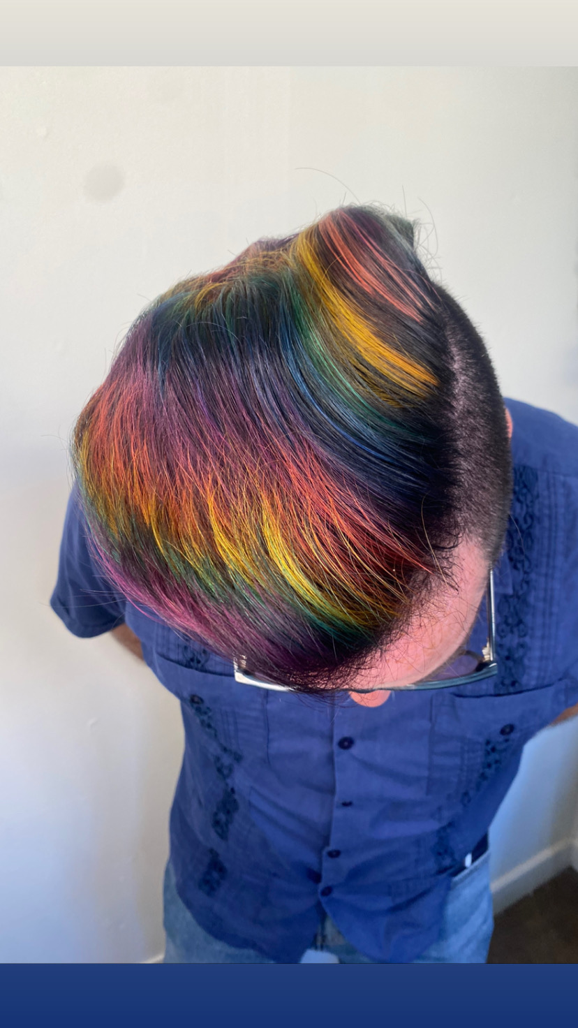 A haircut with rainbow streaks