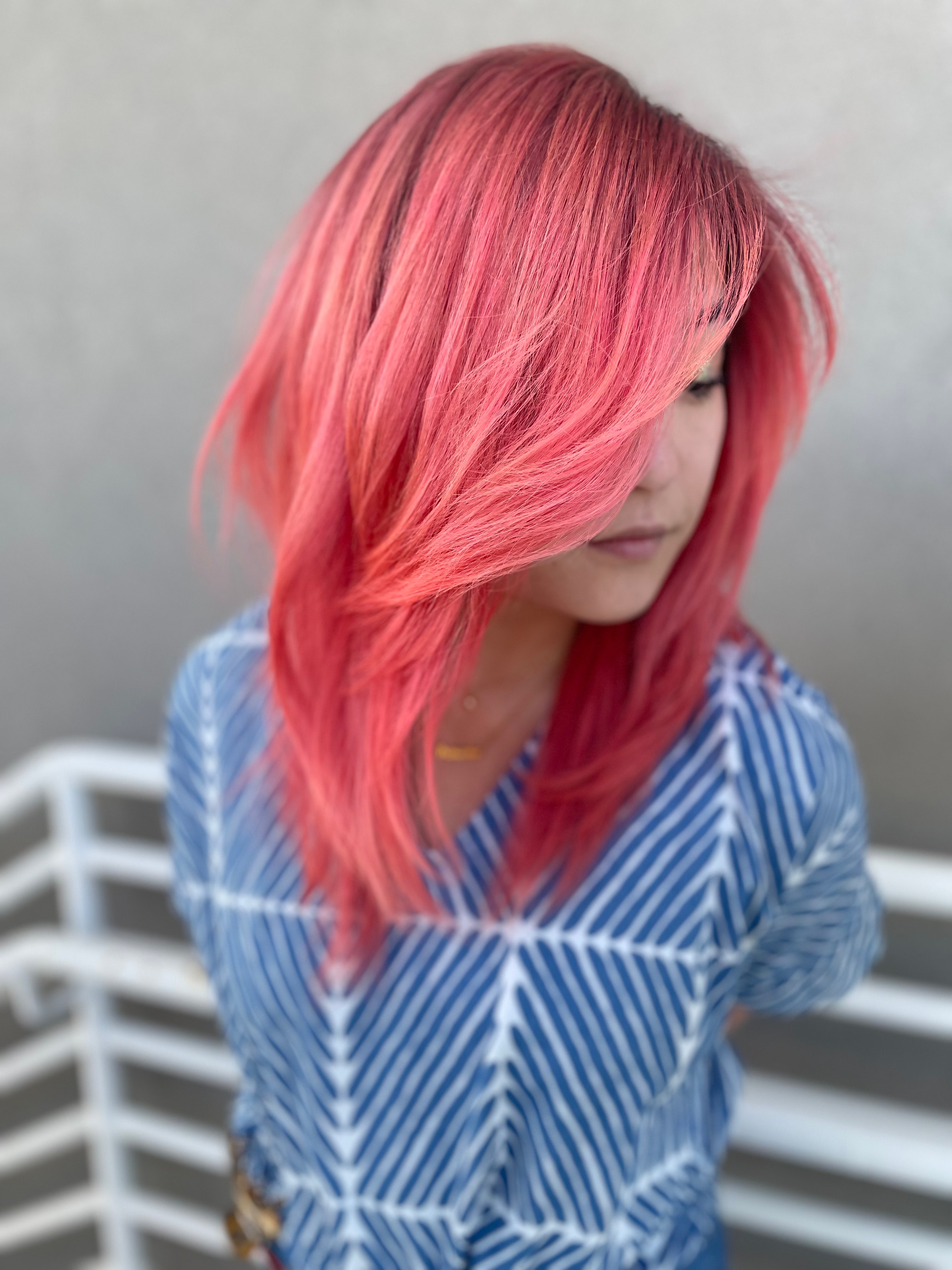 A medium length haircut in pink